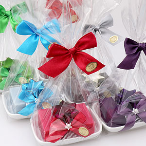 Sheep milk soap 150g on a soap dish, decorated with sorted glass christmas stars in a cellophane, sorted 
